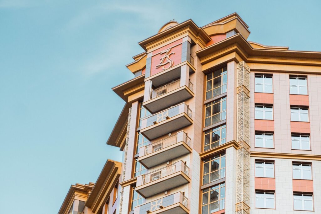Elegant high-rise building facade in Moscow showcasing modern architecture under a clear sky.