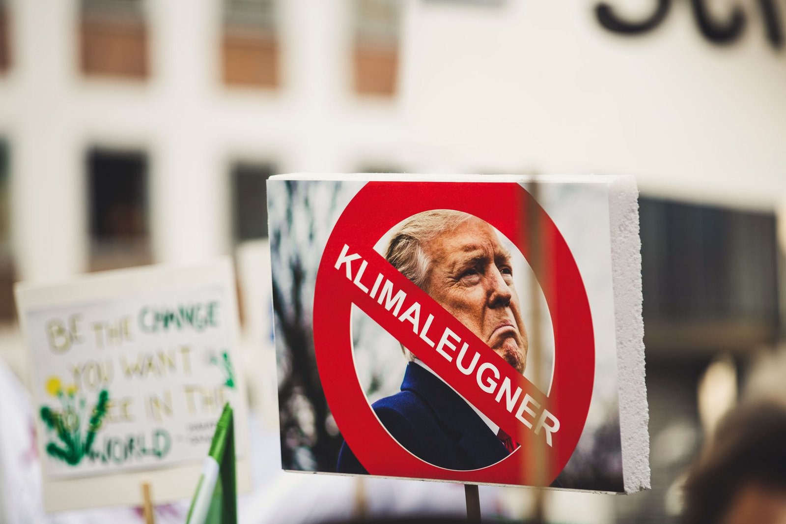 A protest sign at an environmental rally, highlighting climate change advocacy.