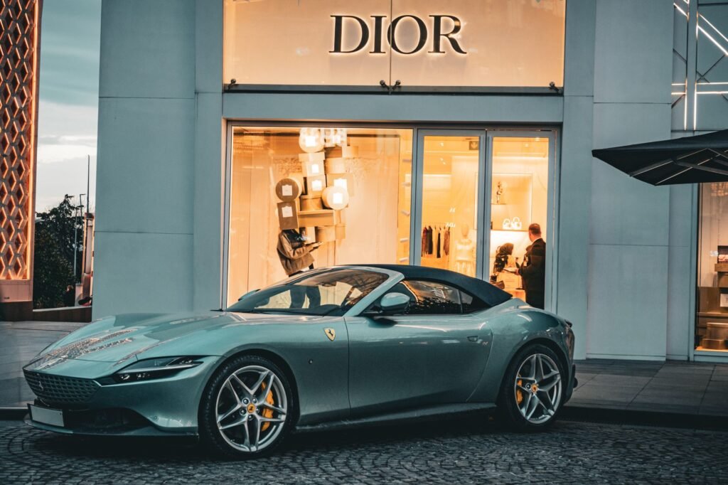 A sleek Ferrari parked in front of a Dior store in Istanbul, capturing a blend of luxury and elegance.