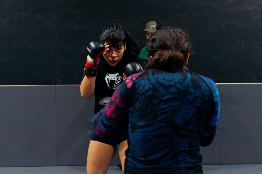 Two women sparring during a martial arts training session in Buenos Aires.