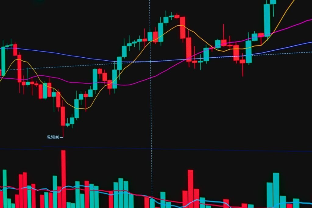 Colorful candlestick chart showing financial trends and data analysis on a digital display.