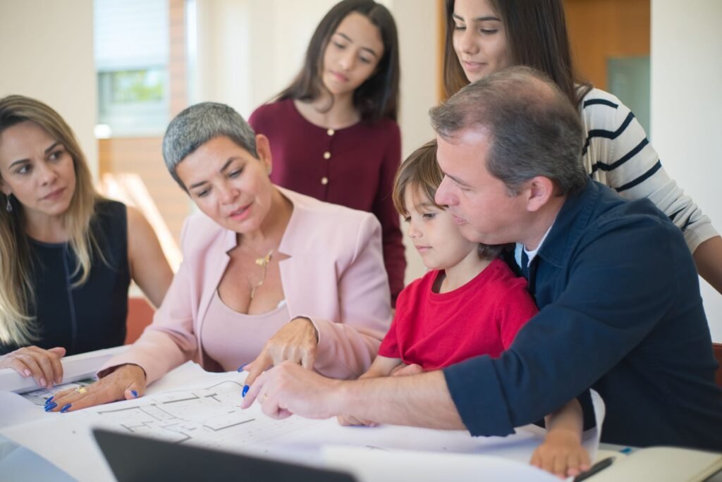 Family meeting with realtor to discuss house plans, emphasizing real estate decision-making.
