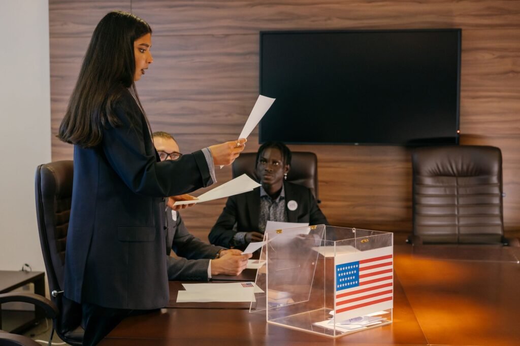A diverse group of professionals engaged in a political discussion or meeting in an office setting.