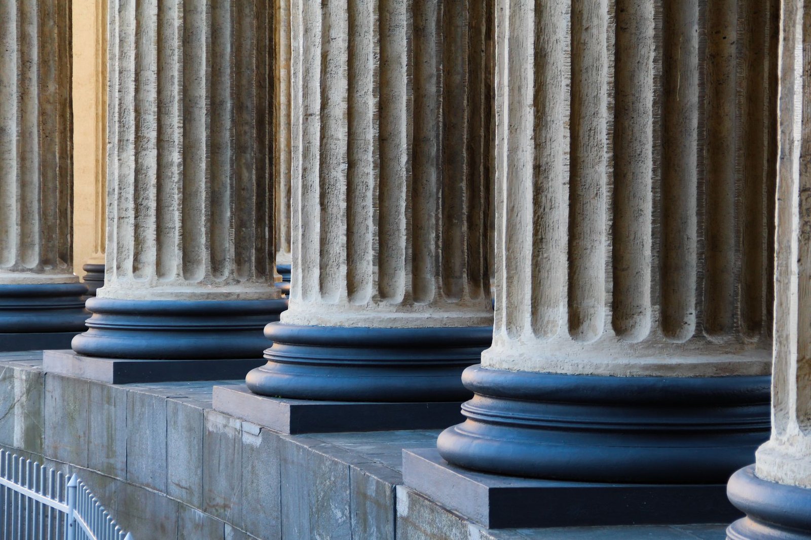 Close-up view of neoclassical columns in St. Petersburg, capturing architectural elegance.