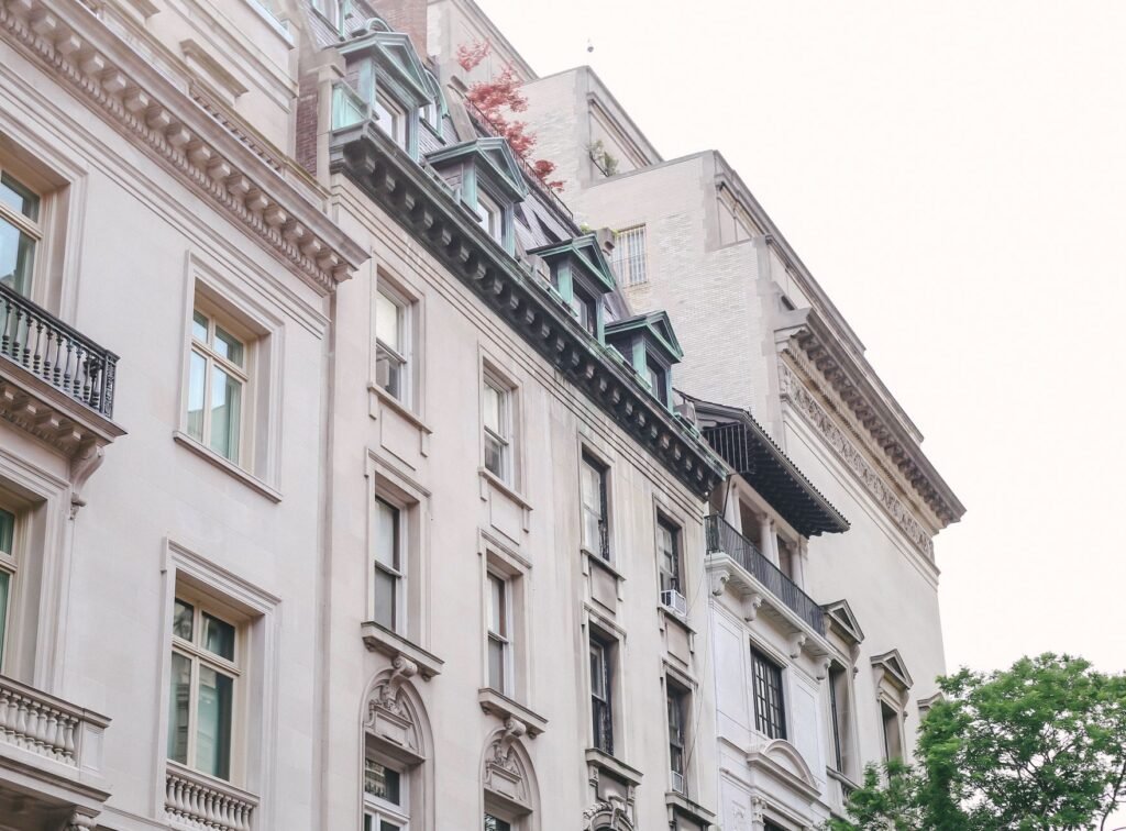 A classic urban building facade with ornate architectural details captured in daylight.