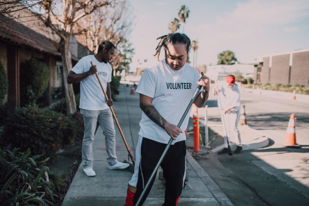 Community volunteers cleaning up streets to promote environmental awareness and social good.