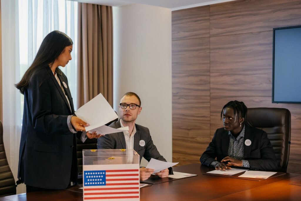 A diverse group of professionals deliberating in a conference room about election plans.