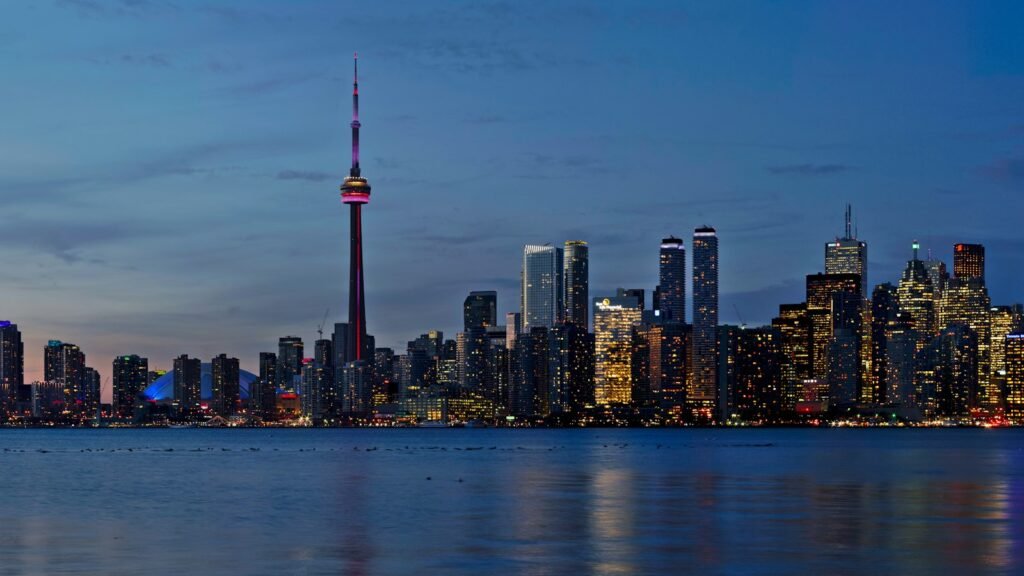 Toronto skyline and the CN Tower at dusk from the waterfront